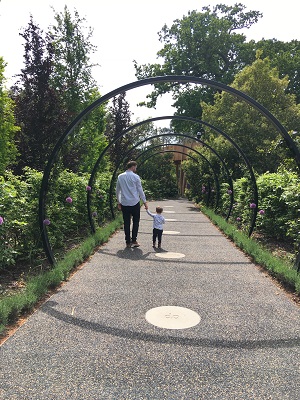 The Neu Dad and his son Marley walking in to the Children's Garden at Kew Gardens